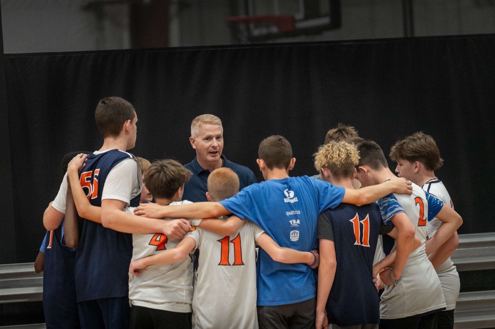 Coach Ricky Bower addresses the Idaho Stags in a team huddle